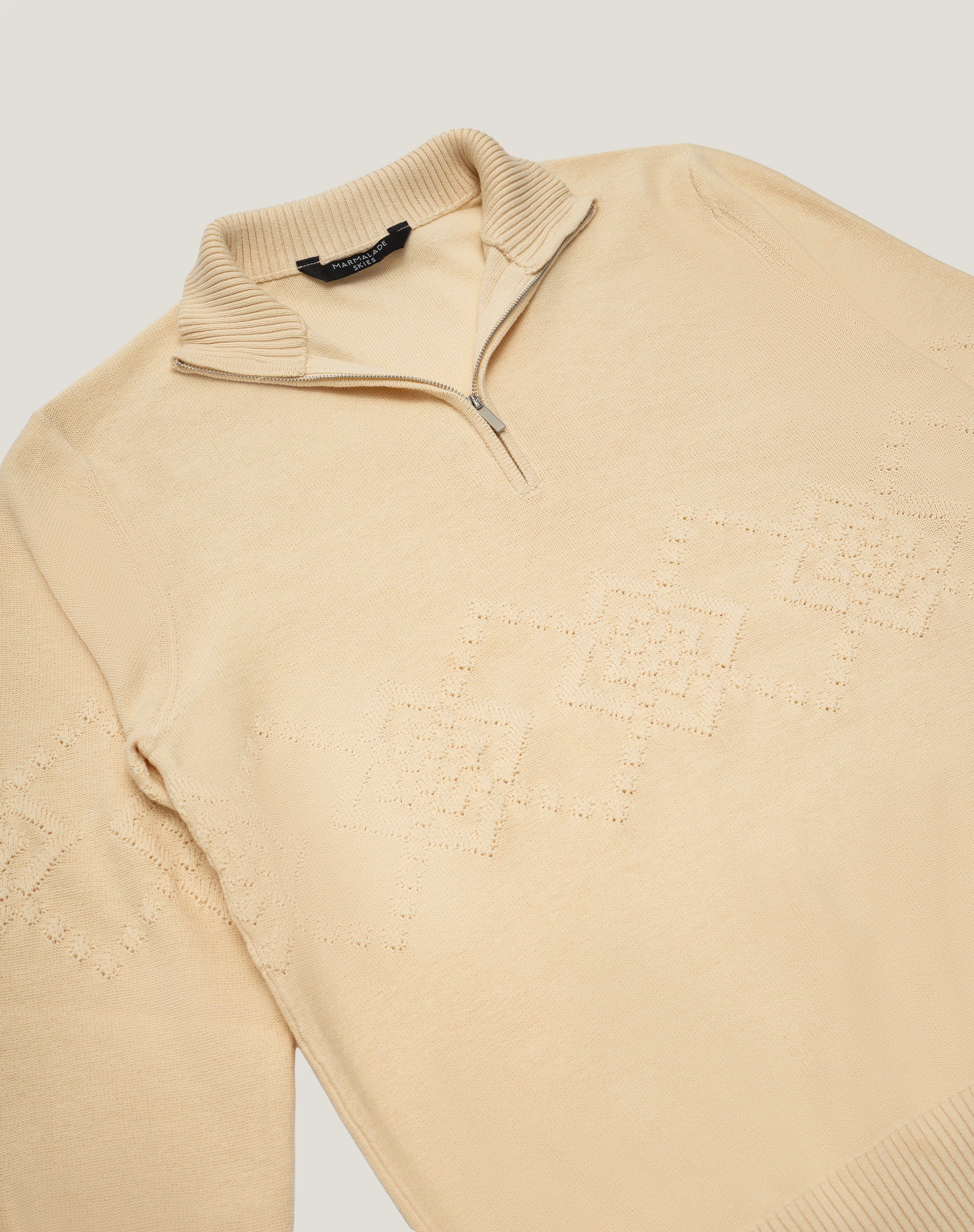 (IVORY) KNITTED COTTON ARGYLE QUARTER ZIP SWEATER